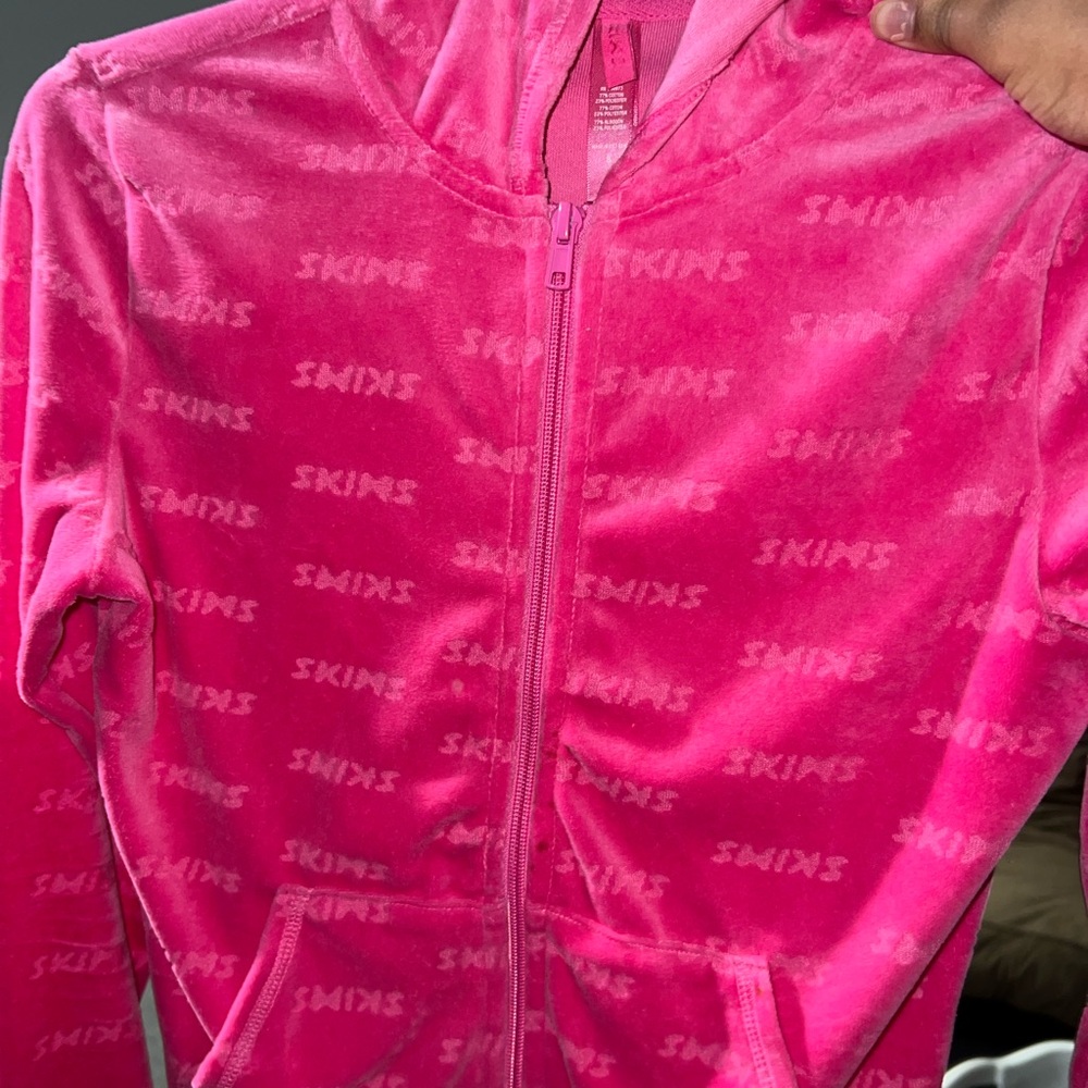 pink skims sweater